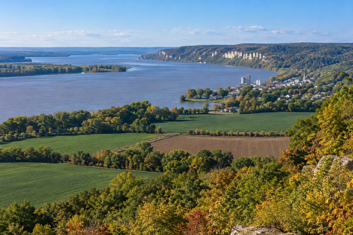 Western Illinois river landscape with Mississippi River bluffs, fields and a distant town
